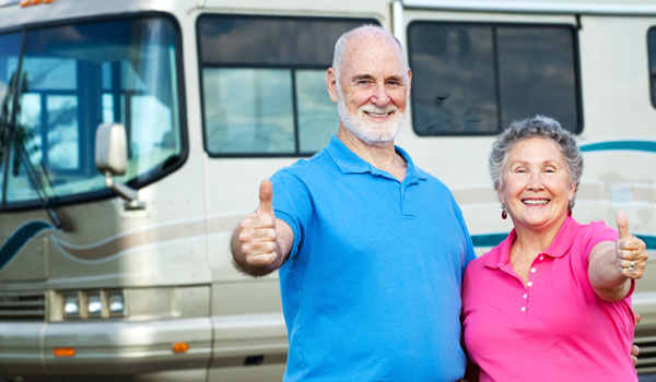 RV Owners in front of Motorhome