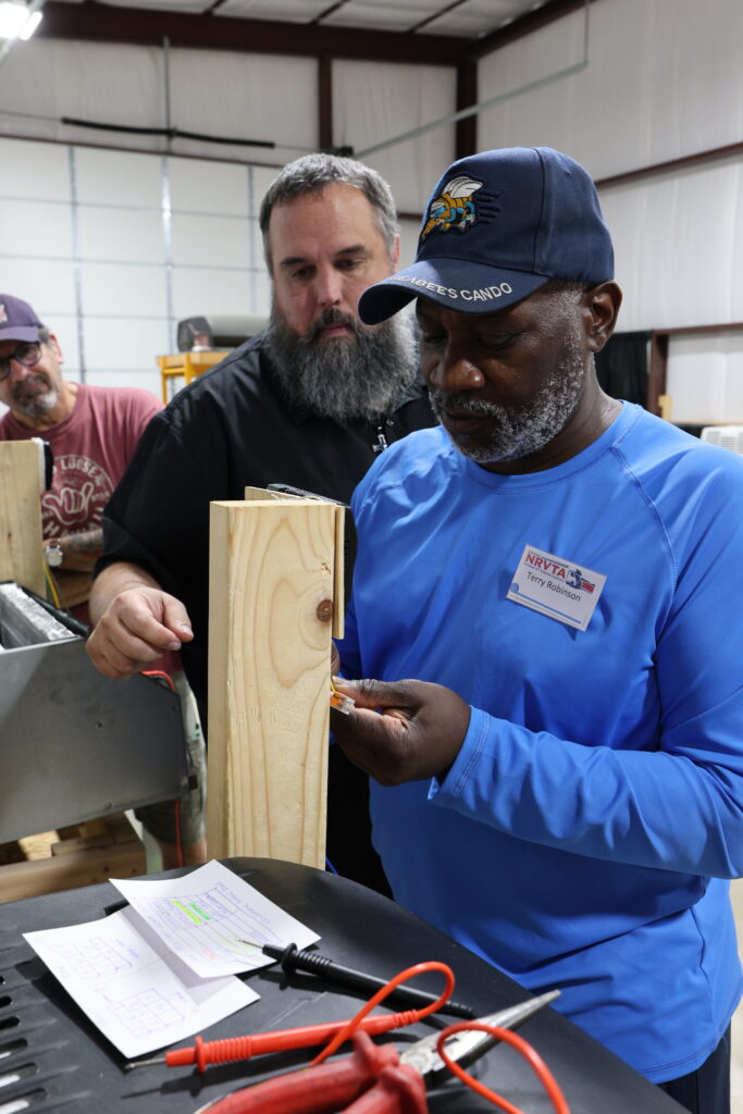 Student learning hands-on RV technician training at the National RV Training Academy.