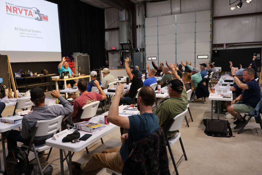 Student learning hands-on RV technician training at the National RV Training Academy.