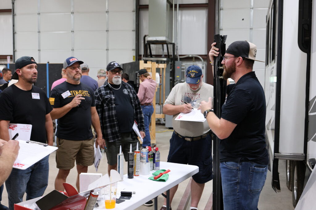 Student learning hands-on RV technician training at the National RV Training Academy.