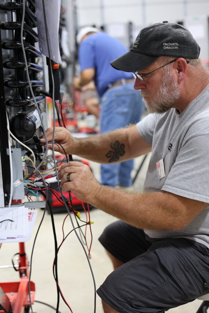 Student learning hands-on RV technician training at the National RV Training Academy.